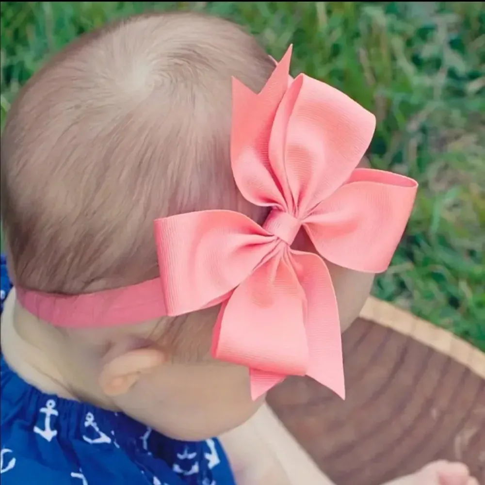 Dětská vlasová čelenka s mašličkou ve středně modré barvě 