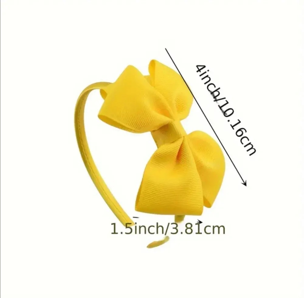 Dětská vlasová čelenka s mašličkou ve žluté barvě 