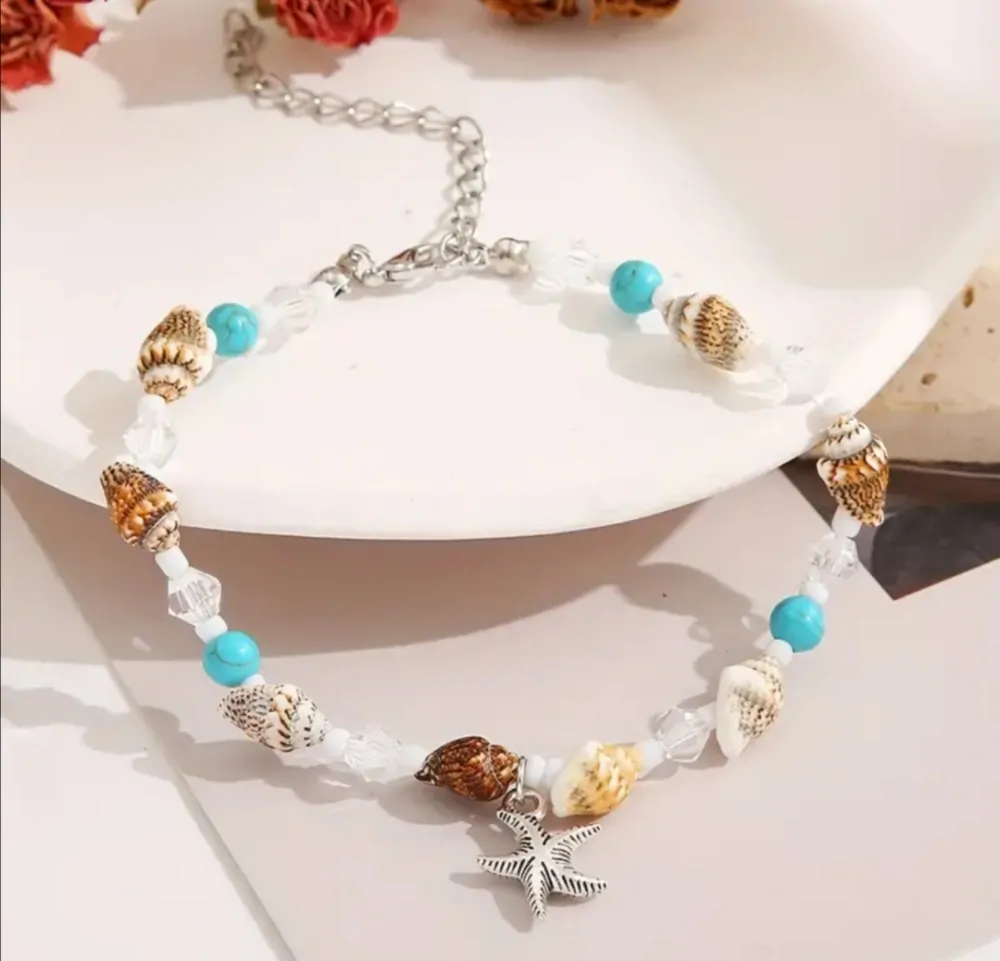 Řetízek na nohu s přívěsky mušliček a mořskou hvězdou 